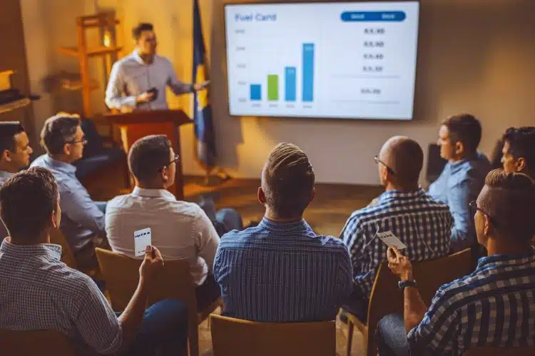 A group of delivery drivers in a meeting