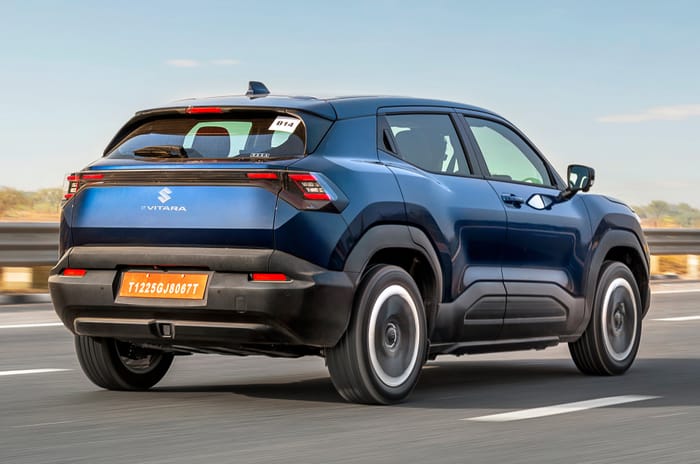 Maruti e Vitara rear right side driving on road